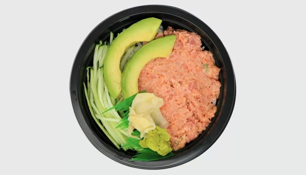 spicy tuna, sliced avocado, cucumber and picked ginger and wasabi with rice in a black bowl